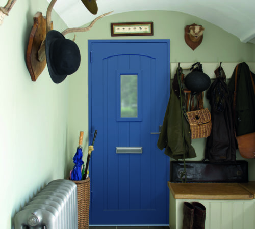 Blue aluminium door leading into entrance