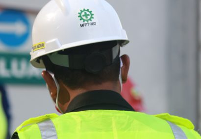 Man wearing high visibility jacket and hard hat